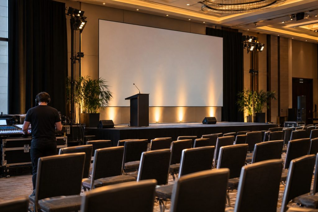 Conference stage and audiovisual equipment during a technical rehearsal